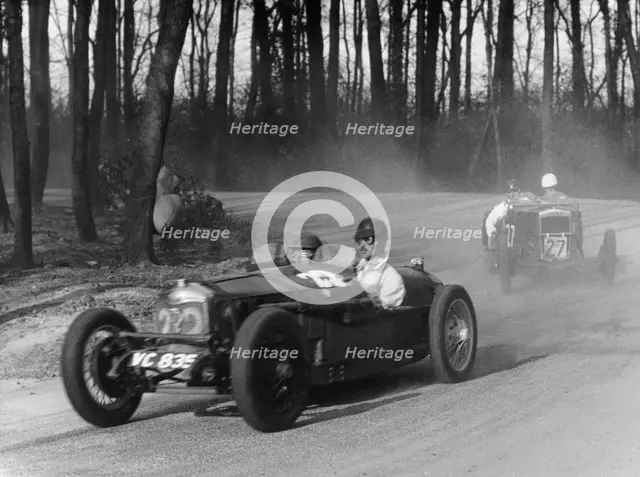 Riley leading a Fraser-Nash through Coppice Corner, Donington Park, Leicestershire, (c1930s?). Artist: Unknown