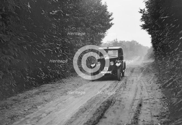 Riley Monaco saloon competing in the Brighton & Hove Motor Club Trial, 1920s. Artist: Bill Brunell.