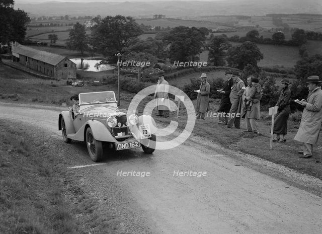 Riley Sprite 2-seater of Mrs TB Hague competing in the South Wales Auto Club Welsh Rally, 1937 Artist: Bill Brunell.