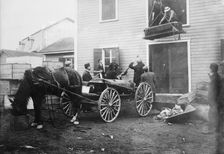 Rimouski - handling coffins of victims, 1914. Creator: Bain News Service