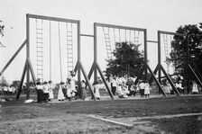 Rings and poles, Bronx Park, 1911. Creator: Bain News Service