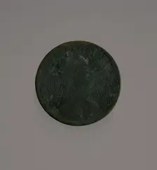 Riot penny charred during the 1921 Tulsa Race Massacre, 1909-1921. Creator: United States Mint