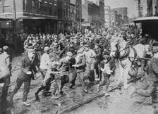 Rioters charging horse-drawn car, later wrecking it on Kensington Ave., Philadelphia, 1910. Creator: Bain News Service