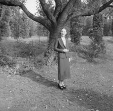 Ruth, standing outdoors by a tree, 1936 Creator: Arnold Genthe