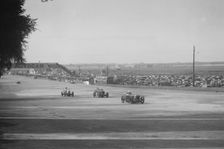 Rubber Duck Austin 7 of LP Driscoll, leading two MG Cs, BRDC 500 Mile Race, Brooklands, 1931. Artist: Bill Brunell