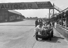 Rubber Duck works Austin 7 of Charles Goodacre in the pits, BRDC 500 Mile Race, Brooklands, 1931. Artist: Bill Brunell