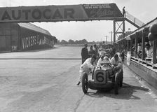 Rubber Duck works Austin 7 of Charles Goodacre in the pits, BRDC 500 Mile Race, Brooklands, 1931. Artist: Bill Brunell