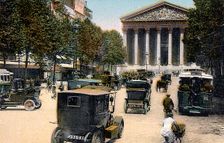 Rue Royale and the Madeleine, Paris, with cars and a motorbus on the street, c1900. Creator: Unknown