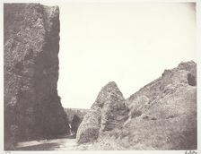 Ruisseau coulant entre une falaise et des rochers, 1854, printed 1978. Creator: Edouard Baldus