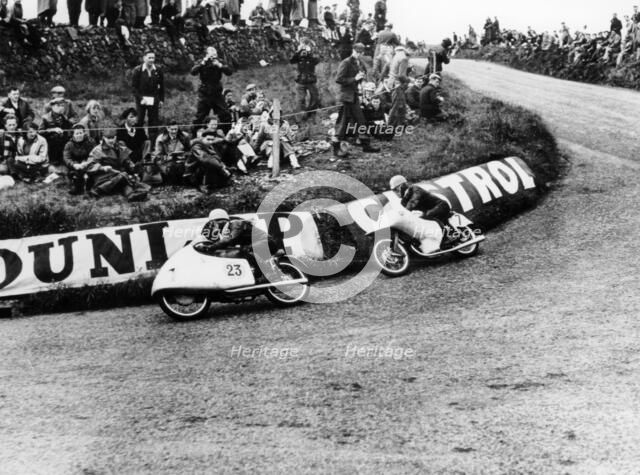 Rupert Hollaus on bike number 23, Carlo Ubbiali on bike number 7, 1954. Artist: Unknown