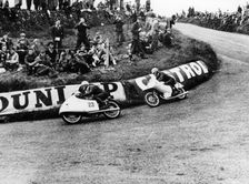 Rupert Hollaus on bike number 23, Carlo Ubbiali on bike number 7, 1954