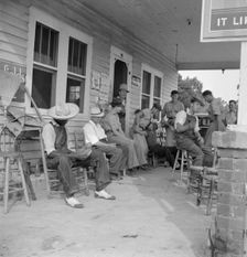 Rural filling station becomes community center...for loafing, near Chapel Hill, North Carolina, 1939 Creator: Dorothea Lange