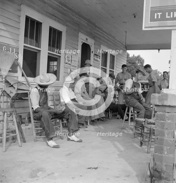 Rural filling station becomes community center...for loafing, near Chapel Hill, North Carolina, 1939 Creator: Dorothea Lange.