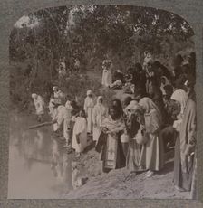 Russian women holding service on the banks of the Jordan c1900