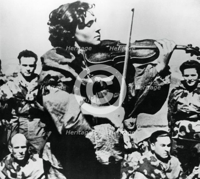 Russian army nurse playing a violin, Eastern Front, 1944. Artist: Unknown