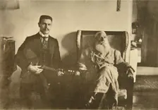Russian author Leo Tolstoy with the balalaika player Boris Troyanovsky, Russia, 1909. Artist: Sophia Tolstaya