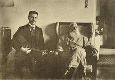 Russian author Leo Tolstoy with the balalaika player Boris Troyanovsky, Russia, 1909. Artist: Sophia Tolstaya