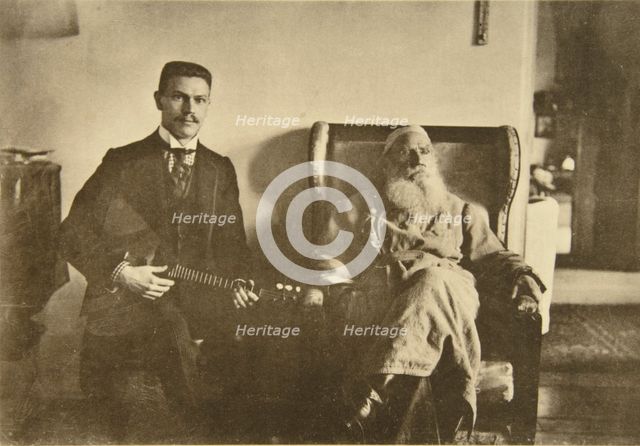 Russian author Leo Tolstoy with the balalaika player Boris Troyanovsky, Russia, 1909. Artist: Sophia Tolstaya