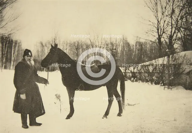 Russian author Leo Tolstoy with a horse, Yasnaya Polyana, near Tula, Russia, 1905.  Artist: Sophia Tolstaya