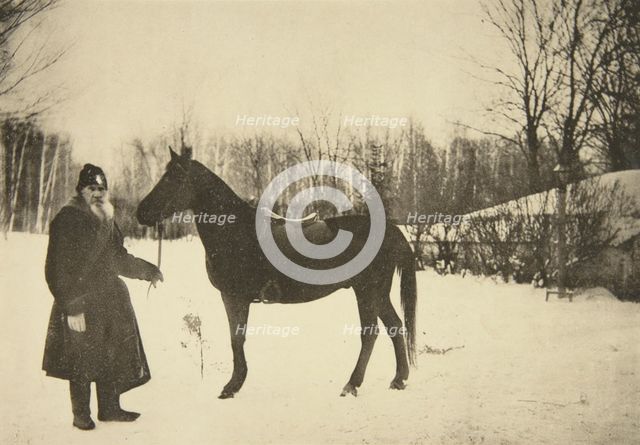 Russian author Leo Tolstoy with a horse, Yasnaya Polyana, near Tula, Russia, 1905.  Artist: Sophia Tolstaya