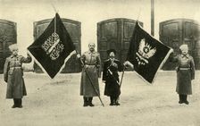 Russian soldiers with captured Turkish flags, First World War, 1915-1916, (c1920). Creator: Unknown