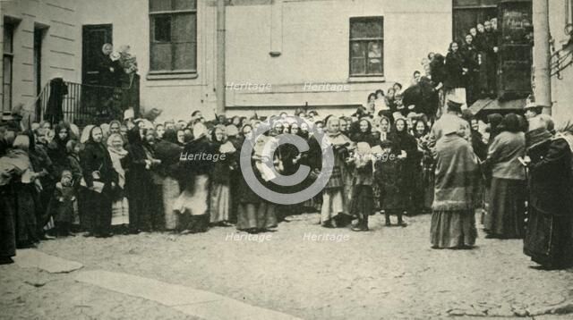 Russian soldiers' wives waiting for news from the Front..., First World War, 1915, (c1920). Creator: Unknown.