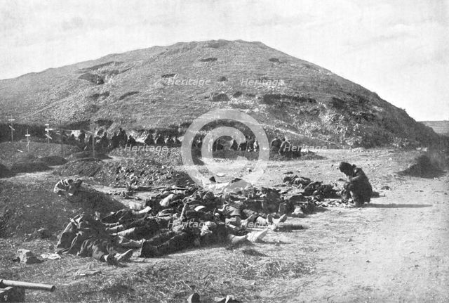 Russian soldiers collecting cartridges from the dead before burial, Russo-Japanese War 1904-5. Artist: Unknown