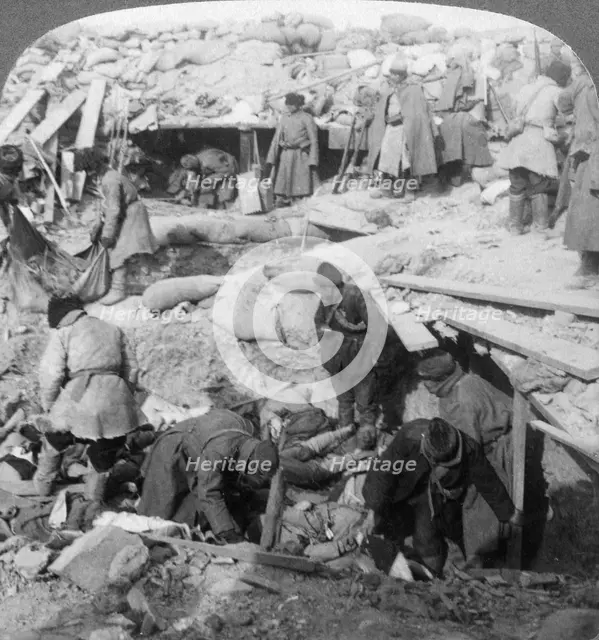 Russians burying Japanese dead inside a fort, Port Arthur, Manchuria, Russo-Japanese War, 1905. Artist: Underwood & Underwood