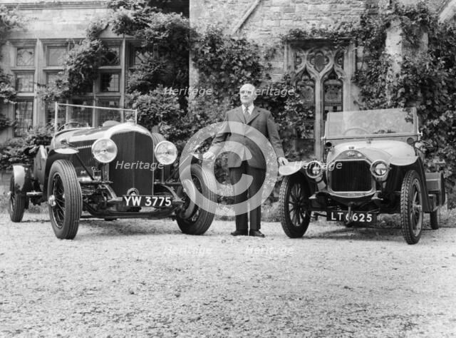 WO Bentley standing between two of his cars. Artist: Unknown