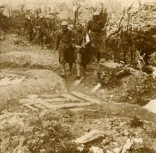 Wounded French infantrymen arriving at Chateau d'Esnes, Verdun, northern France, 1916