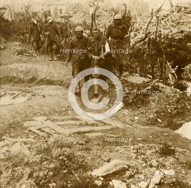 Wounded French infantrymen arriving at Chateau d'Esnes, Verdun, northern France, 1916. Artist: Unknown.