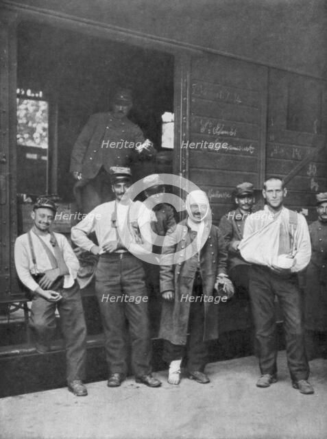 Wounded French soldiers on the way to hospital by train France, 1914. Artist: Unknown