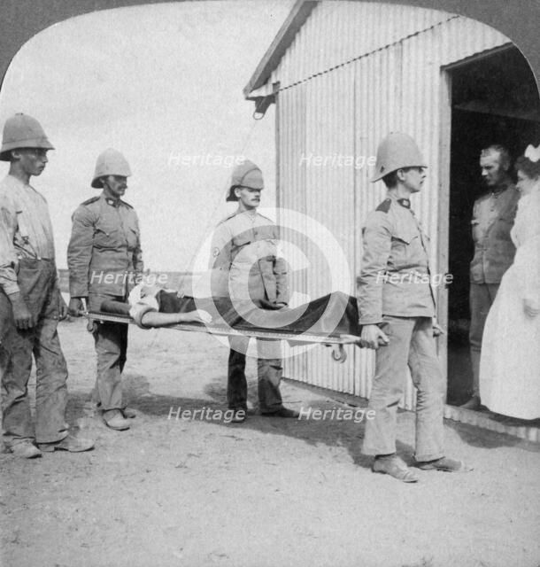 'Wounded fusilier after the Boers' brave stand near Orange River', South Africa, Boer War, 1900. Artist: Underwood & Underwood