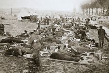Wounded men waiting to be taken away to a clearing station, France, World War I, 1916. Creator: Unknown