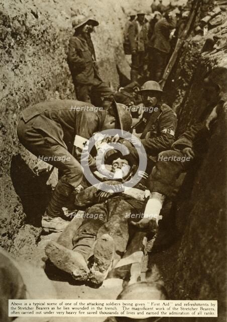 Wounded soldier being treated in the trenches, Battle of the Somme, First World War, 1916, (1935). Creator: Unknown.
