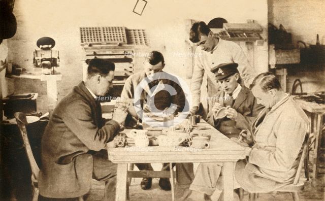 Wounded soldiers in pottery class...Devon, First World War, 1914-1918, (1933).  Creator: Unknown.