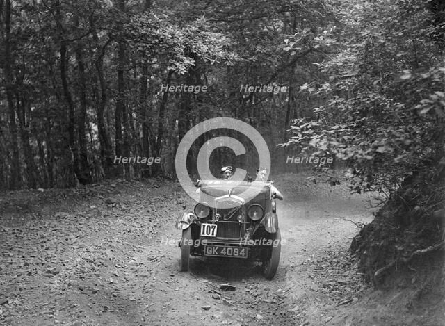 Wolseley Hornet McEvoy Special, B&HMC Brighton-Beer Trial, Fingle Bridge Hill, Devon, 1934. Artist: Bill Brunell.