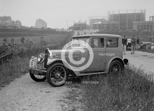 Wolseley Hornet saloon of DEM Douglas-Morris at the B&HMC Brighton Motor Rally, 1930. Artist: Bill Brunell.