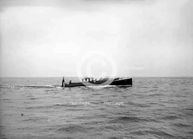 Wolseley motor launch under way, 1913. Creator: Kirk & Sons of Cowes.