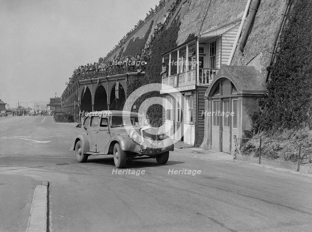 Wolseley saloon of HB Brownright and HE Symons on Madeira Drive, Brighton, RAC Rally, 1939. Artist: Bill Brunell.