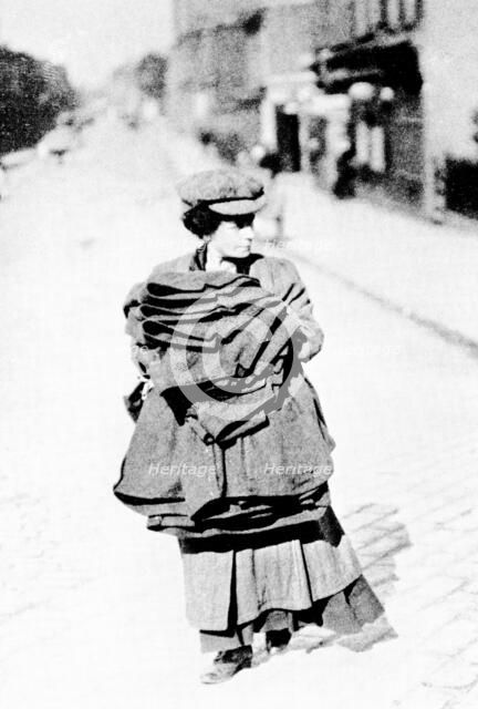 Woman carrying sacks, London, c1900. Artist: Unknown