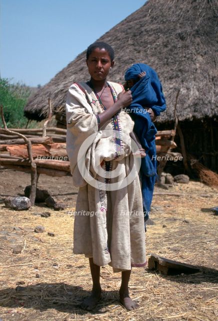 Woman and baby in a village near the Blue Nile Falls, Ethiopia.  Creator: Vivienne Sharp.