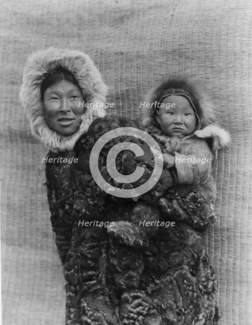 Woman and child, Nunivak, c1929. Creator: Edward Sheriff Curtis.