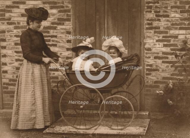 'Woman and children in a pushchair', 1937. Artist: Unknown.