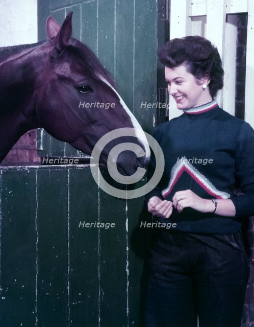 Woman and horse, c1955. Creator: Arthur Charles Kirby Ware.
