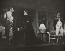 Woman and two men, standing, 1938. Creator: Unknown