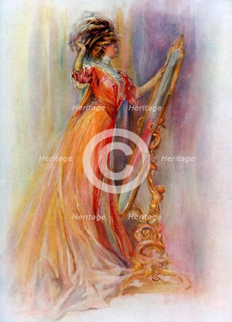 Woman admiring herself in a mirror, 1908-1909.Artist: Hubner & Wilson 