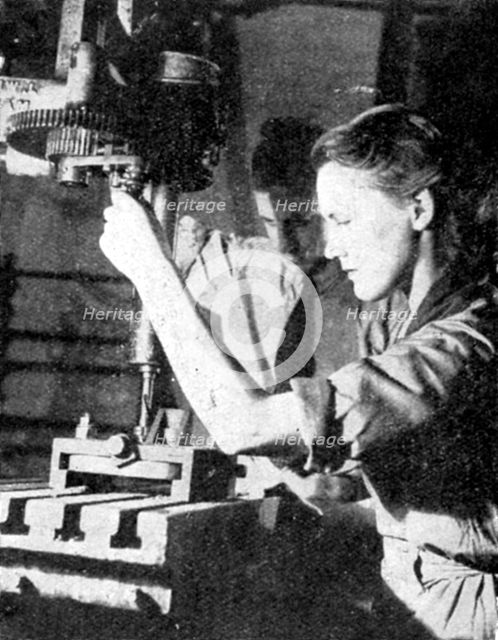 Woman armaments worker, World War II, 1940. Artist: Unknown