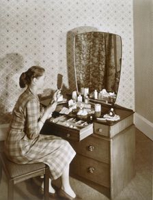 Woman at her dressing table, c1955. Creator: English Photographer (20th Century)