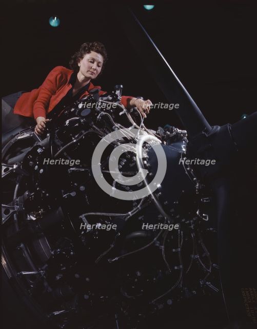 Woman at work on motor, Douglas Aircraft Company, Long Beach, Calif., 1942. Creator: Alfred T Palmer.